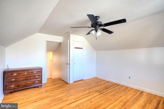 bonus room featuring light hardwood / wood-style floors, ceiling fan, and lofted ceiling