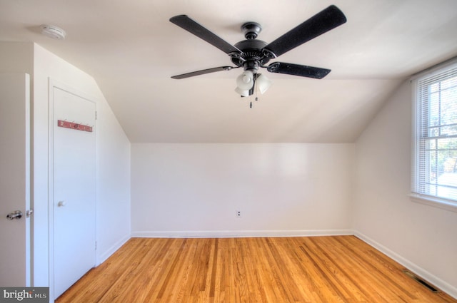 additional living space featuring lofted ceiling, ceiling fan, and light hardwood / wood-style flooring