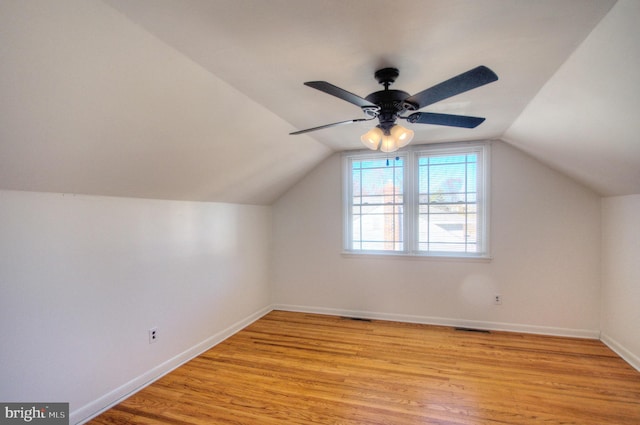 bonus room featuring ceiling fan, light wood-type flooring, and vaulted ceiling