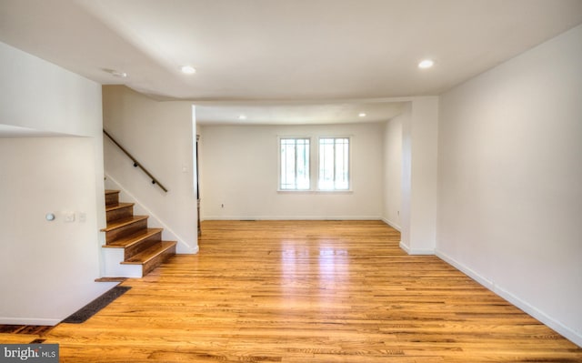 basement with light hardwood / wood-style floors