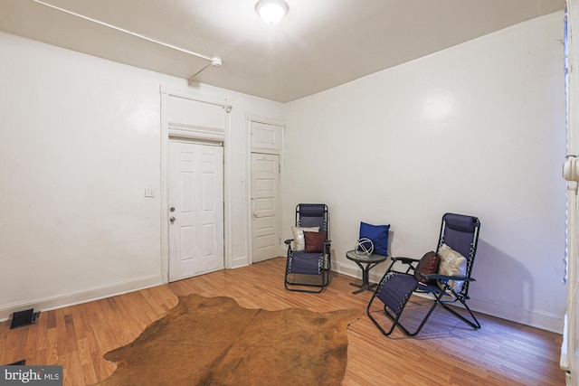 sitting room featuring hardwood / wood-style flooring