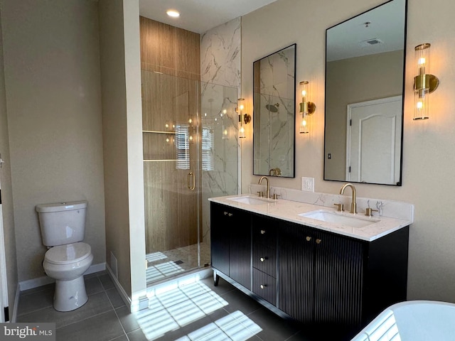 bathroom with vanity, tile patterned floors, toilet, and an enclosed shower