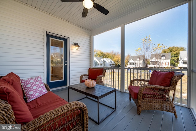 sunroom with ceiling fan and wood ceiling