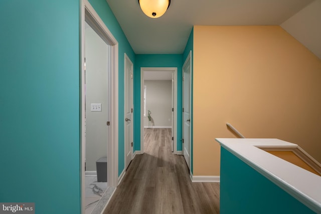 corridor with light wood-type flooring