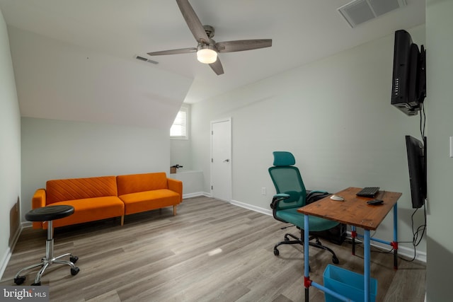 office with ceiling fan, light hardwood / wood-style floors, and vaulted ceiling