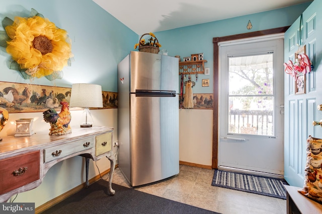 kitchen featuring stainless steel fridge