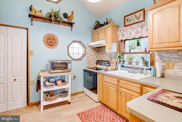 kitchen with light brown cabinetry, electric stove, sink, and light hardwood / wood-style flooring