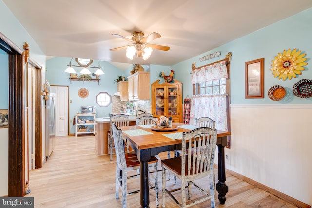 dining room featuring light hardwood / wood-style floors and ceiling fan