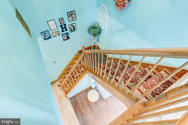 staircase featuring hardwood / wood-style floors