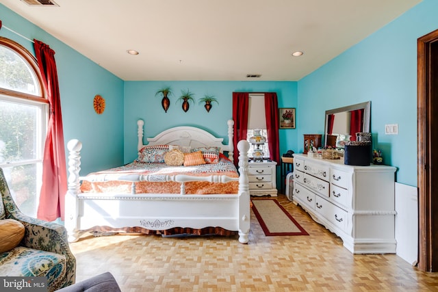 bedroom featuring light parquet floors