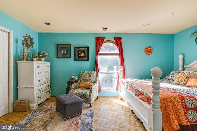 bedroom featuring light parquet floors