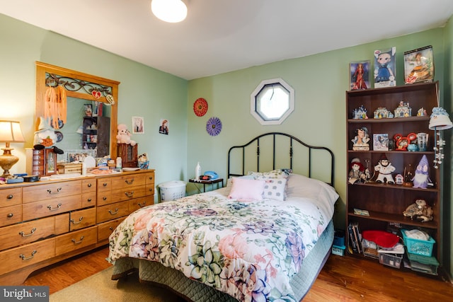 bedroom with hardwood / wood-style flooring