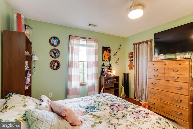 bedroom with hardwood / wood-style flooring