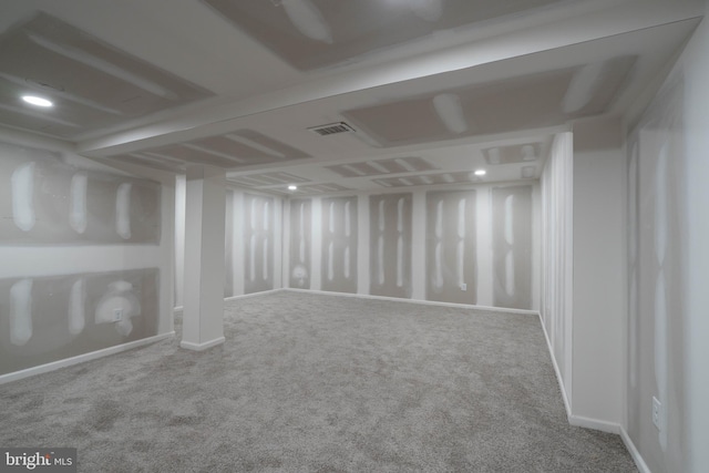 basement featuring carpet flooring