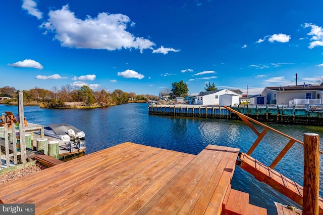 dock area with a water view