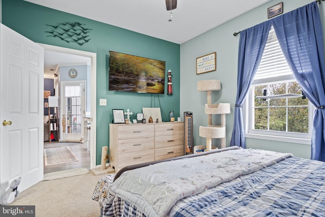 carpeted bedroom featuring ceiling fan