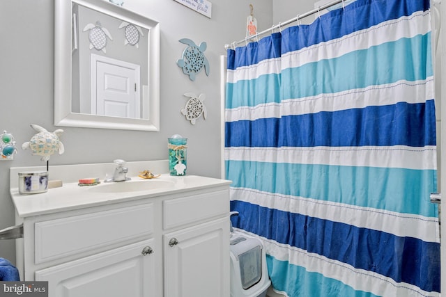 bathroom featuring vanity and walk in shower