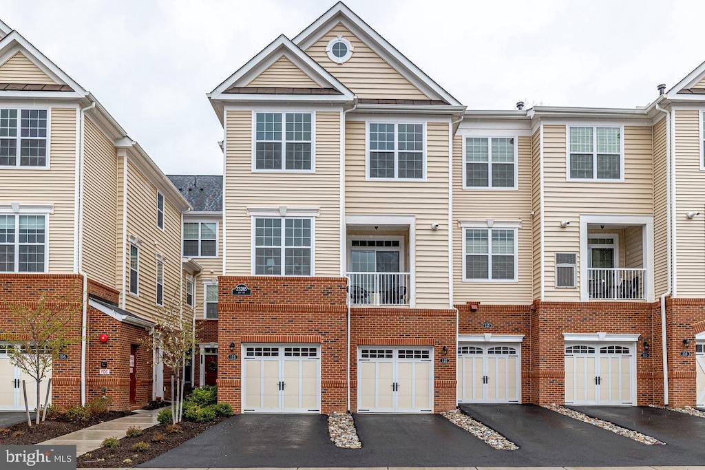 multi unit property featuring a garage