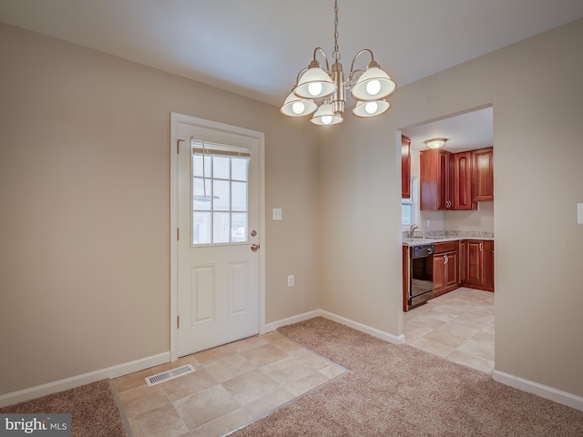 doorway to outside featuring sink, an inviting chandelier, and light carpet