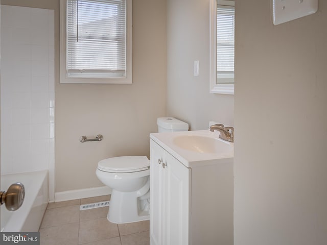 bathroom featuring toilet, vanity, and tile patterned floors