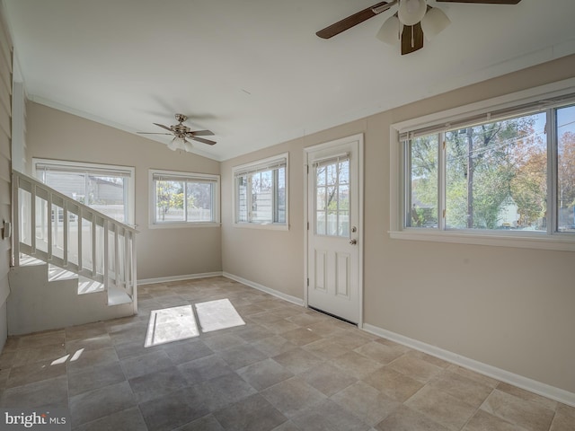 interior space featuring a wealth of natural light, ceiling fan, and lofted ceiling