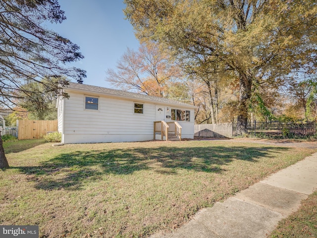 back of house with a yard