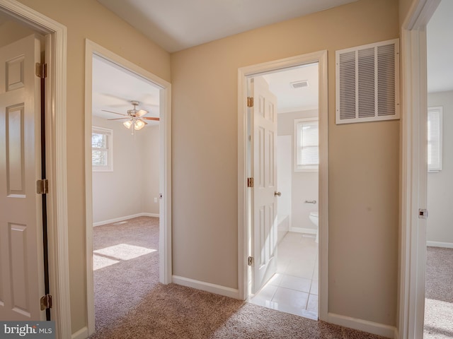 hall with light carpet