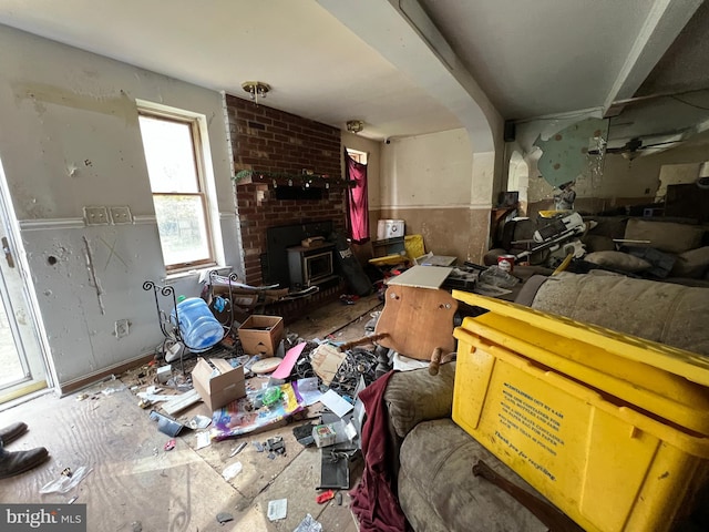 94 Pine Rd, Pasadena, MD 21122 - living room featuring a wood stove and arched walkways