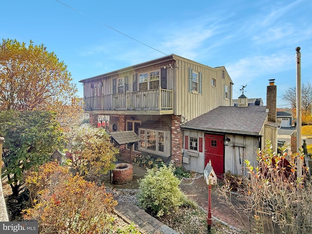 rear view of house with a balcony