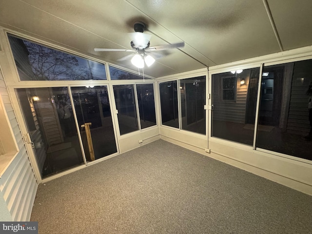 unfurnished sunroom with ceiling fan and lofted ceiling