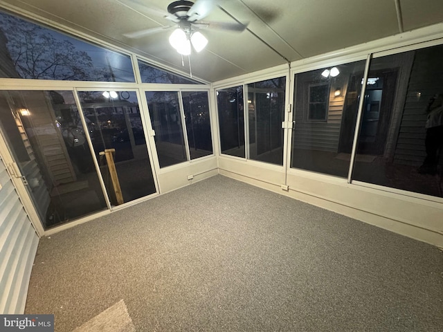 unfurnished sunroom featuring ceiling fan and lofted ceiling