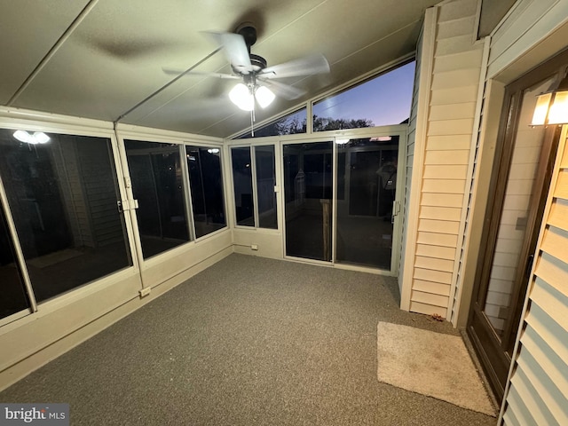 unfurnished sunroom with ceiling fan and lofted ceiling