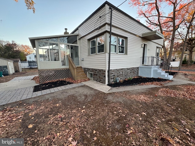 view of front of house with a sunroom