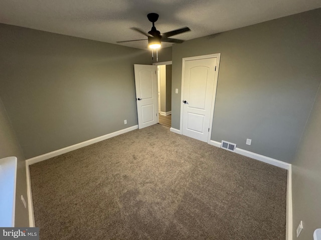 unfurnished bedroom with carpet floors and ceiling fan