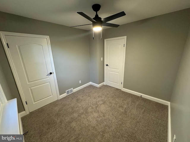 unfurnished bedroom with ceiling fan and carpet floors