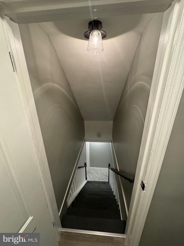 stairway featuring hardwood / wood-style flooring