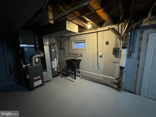 basement featuring heating unit and water heater