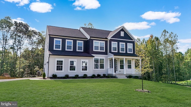 view of front of house with a front yard and a porch
