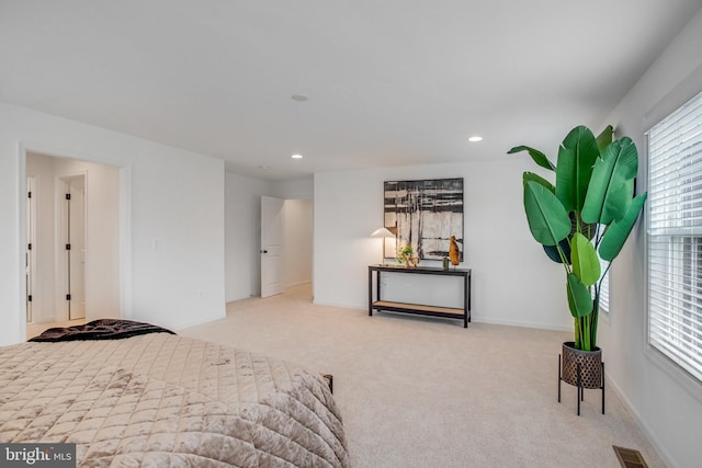 carpeted bedroom with recessed lighting