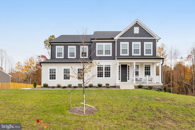 view of front of home featuring a front yard and covered porch