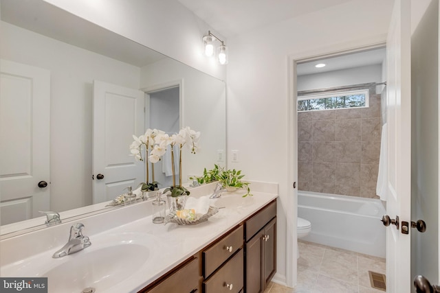 full bathroom with toilet, double vanity, shower / bathtub combination, and tile patterned floors