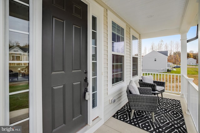 balcony featuring a porch