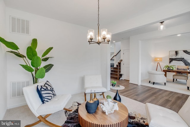 living room with stairway, a chandelier, wood finished floors, baseboards, and recessed lighting