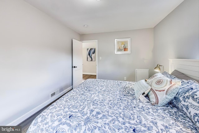 bedroom featuring dark wood-type flooring