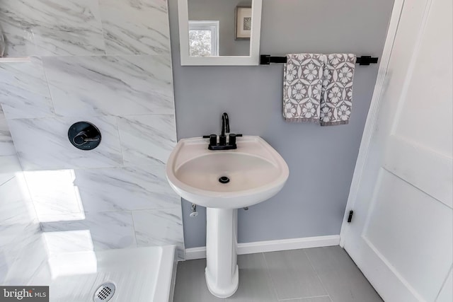 bathroom with a tile shower