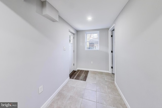 hallway with light tile patterned floors