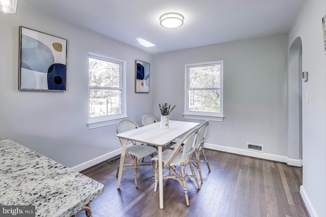 dining area featuring dark hardwood / wood-style flooring