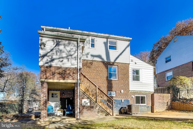 rear view of house featuring central AC and a patio