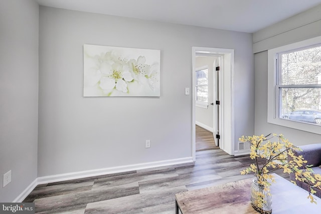 unfurnished room featuring hardwood / wood-style flooring