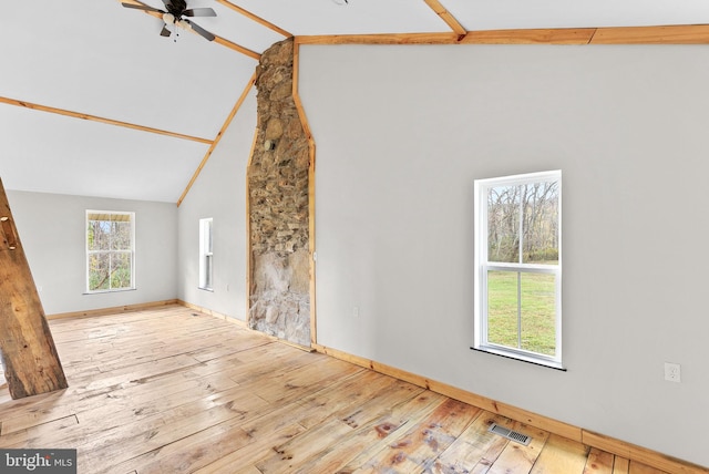 interior space with light wood-type flooring, high vaulted ceiling, and ceiling fan